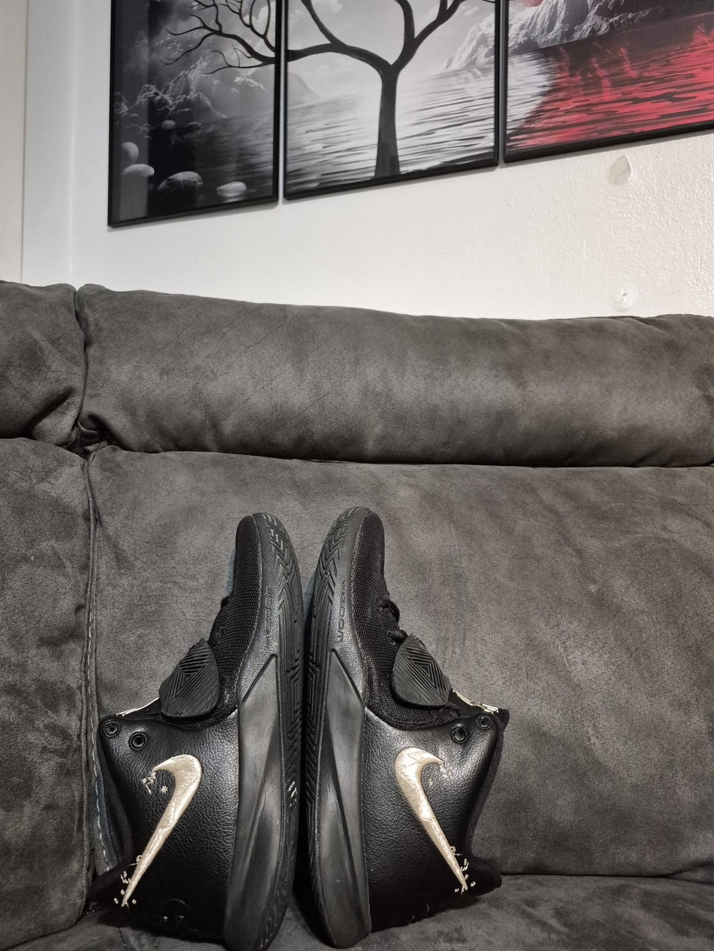 Nike Men’s Black Athletic Shoes with Gold Swoosh